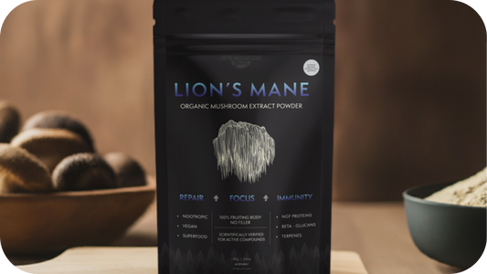Close-up image of Lion’s Mane Organic Mushroom Extract Powder packaging, featuring key benefits such as repair, focus, and immunity. The background features a bowl of mushrooms, highlighting the product's natural, organic qualities.